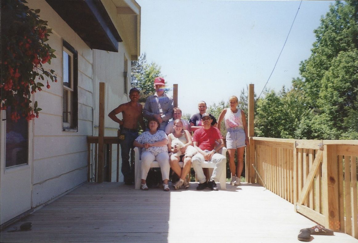 Roy and family building deck